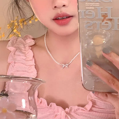 PQT-992 Bow Shape Pearl Pendant Necklace – Elegant Women’s Jewelry in Silver & Gold Finish